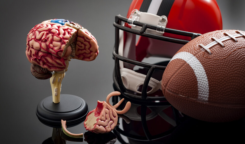 Football helmet, football, and brain diagram