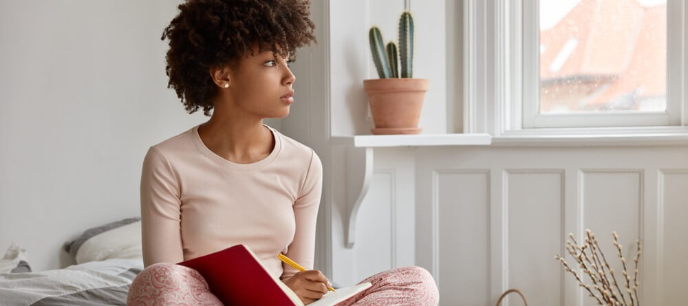 Women journaling as part of CBT.