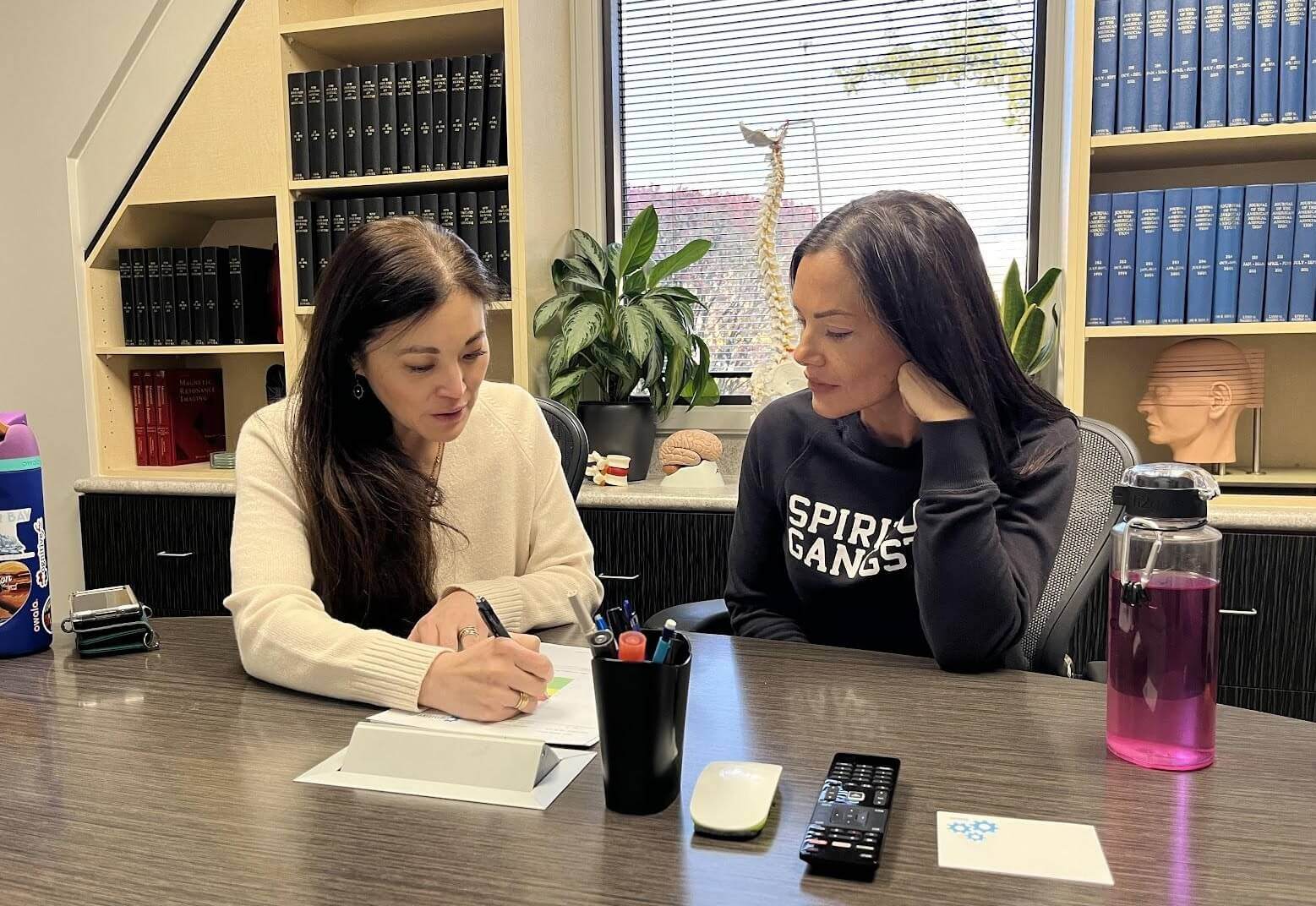 Dr. Alina Fong meeting with a patient