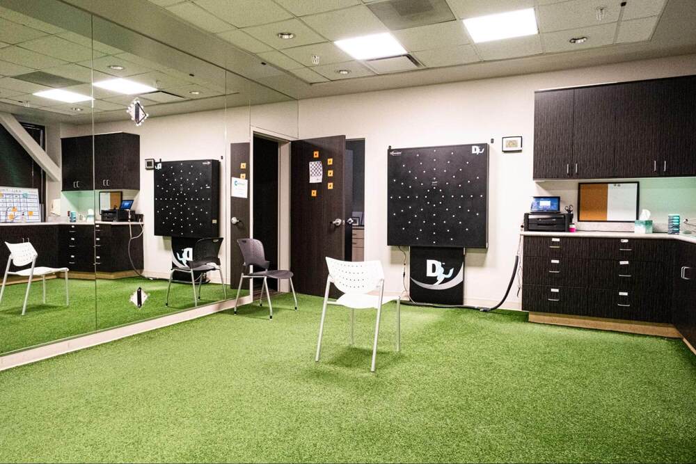 A therapy room at Cognitive FX with two Dynavision boards and exercise space