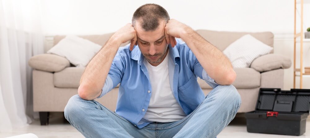 A man struggling with brain fog. 