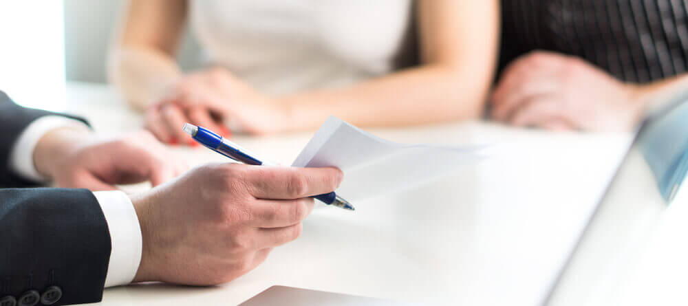 Lawyer and client going over legal documents