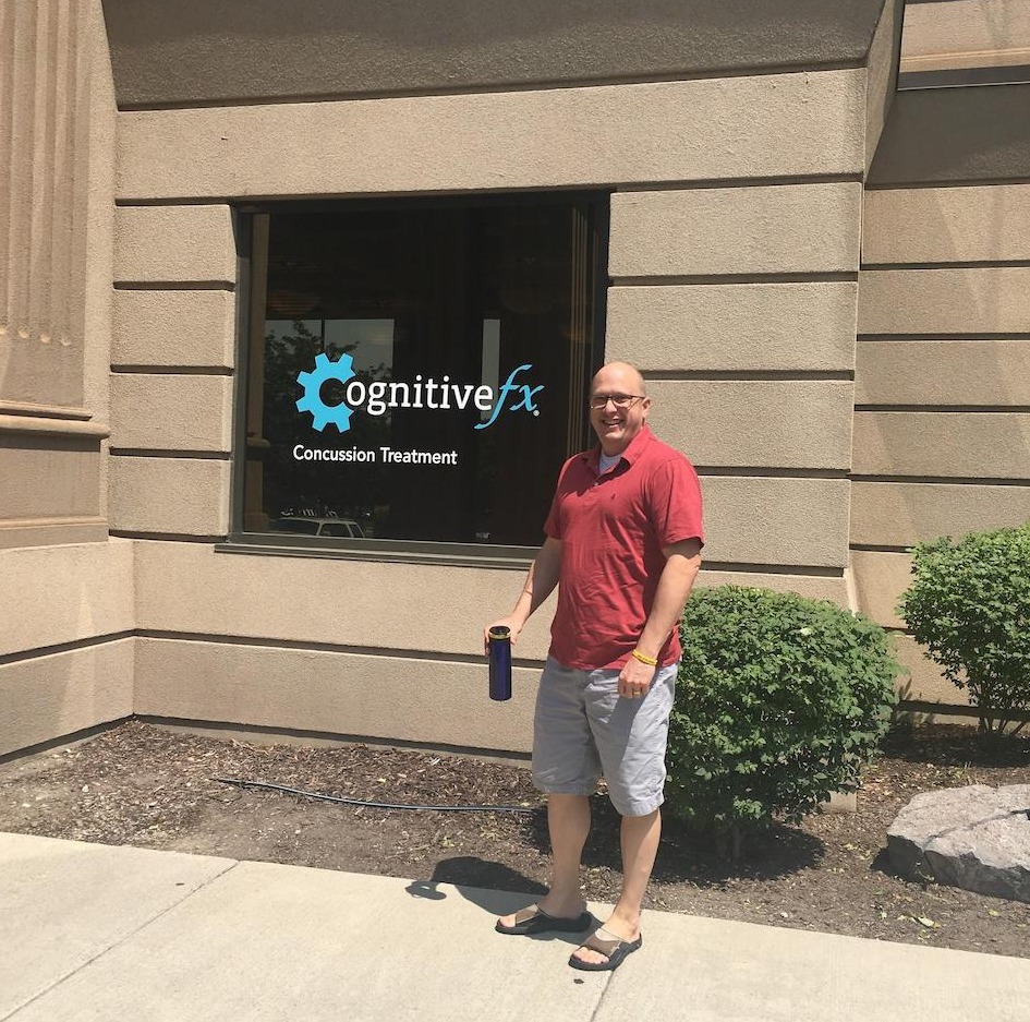 A photo of Sam Gray in front of the Cognitive FX facility in Utah.