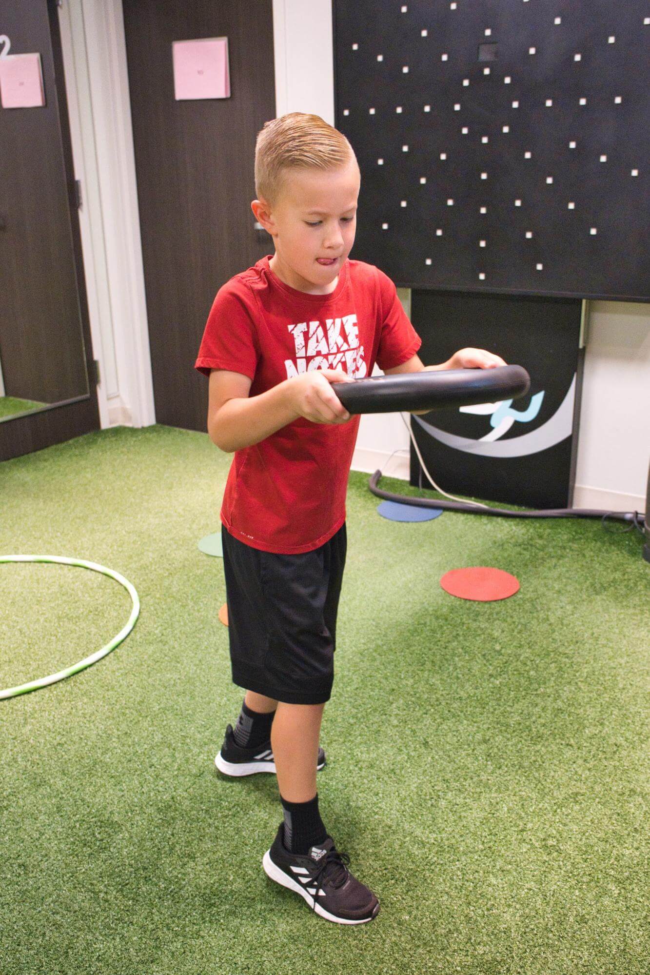 A young man performs an exercise at Cognitive FX. 