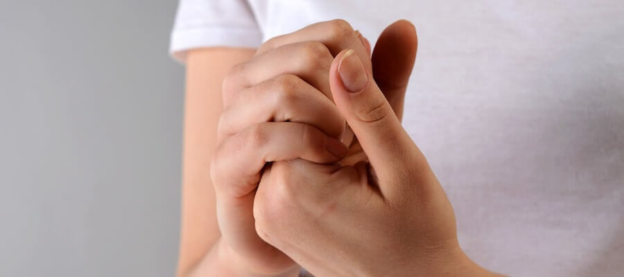 Holding hands to test for feeling in fingers