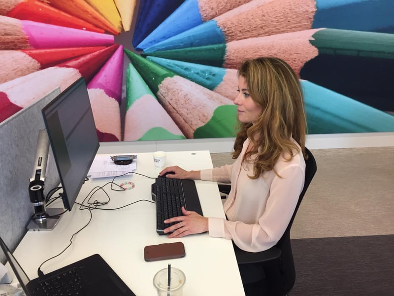 A photo of Quirien working at her desk back at her office.