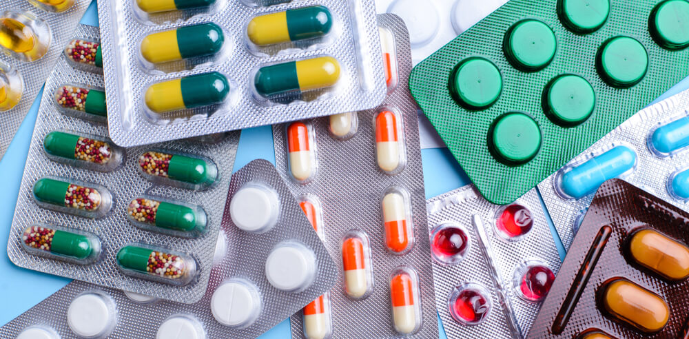 Various blister pack medications on a table