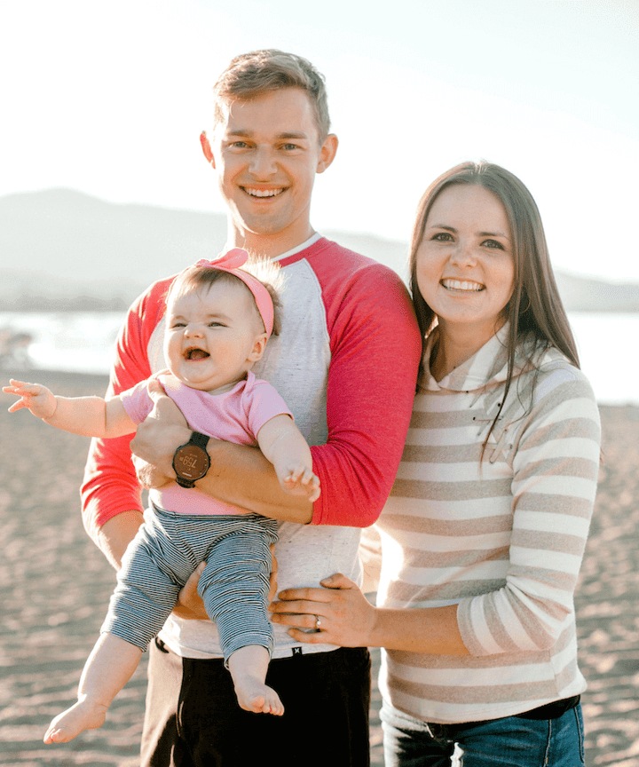 A photo of Nate Benson with his wife and daughter.
