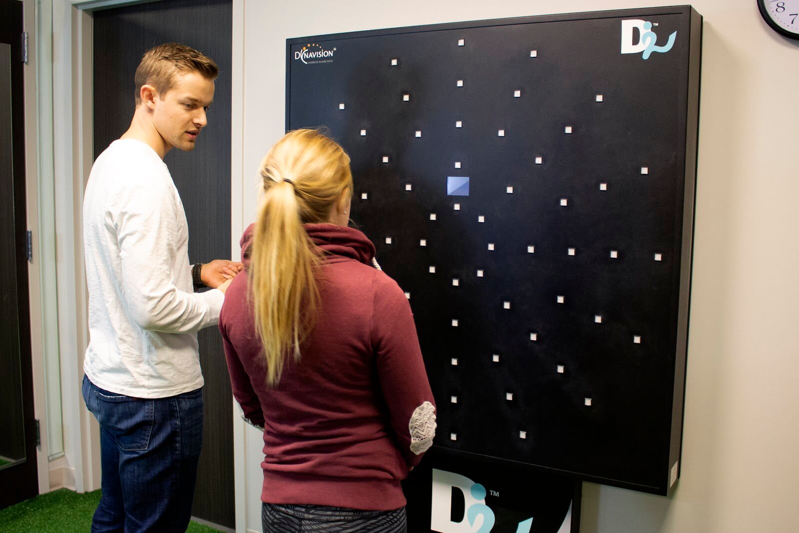 Nate working with a patient at the Dynavision board.