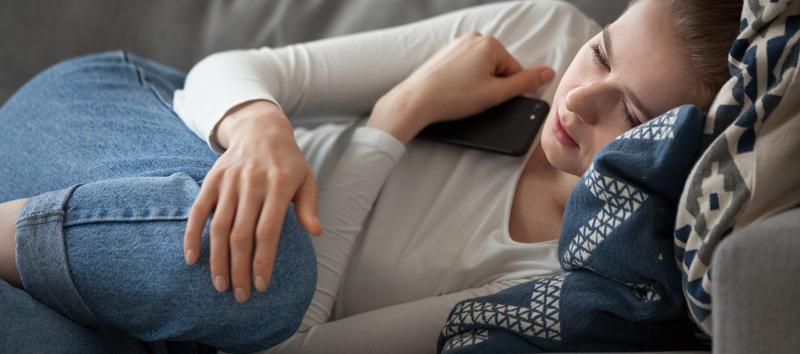 woman lying down in pain