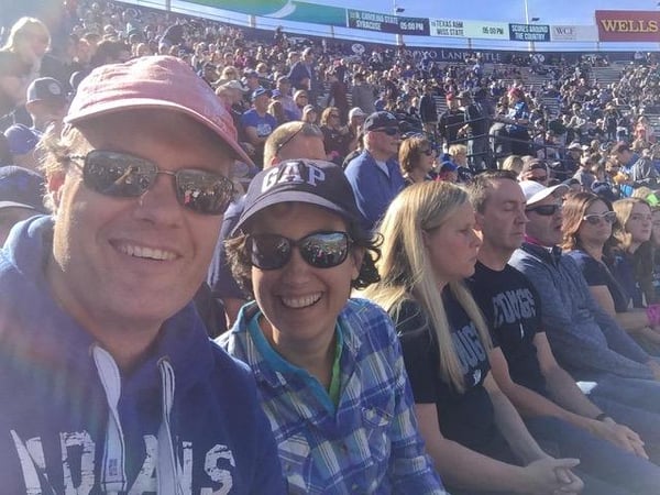 Myrthe and her husband at a football game