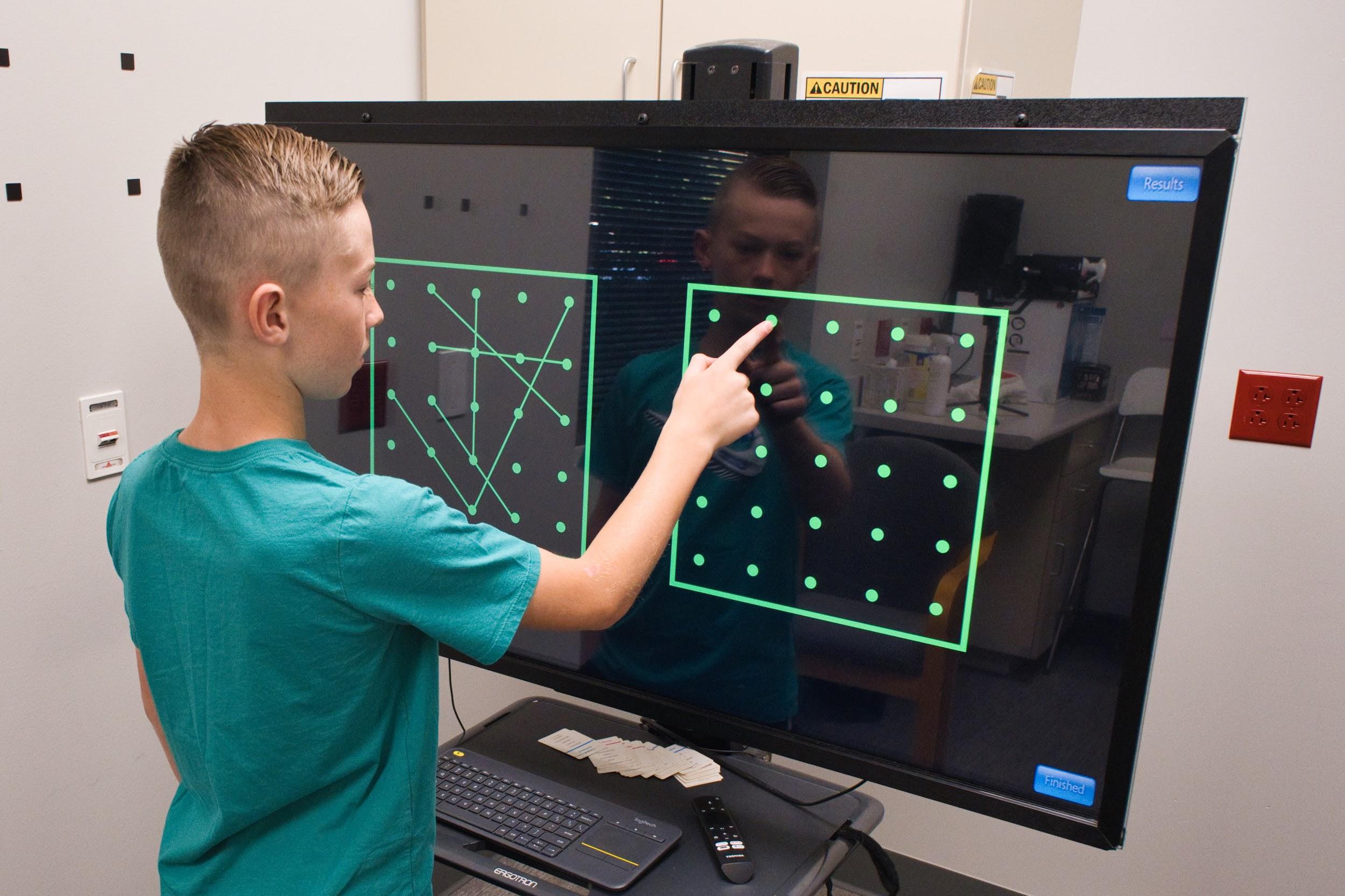 A boy during EPIC treatment at Cognitive FX.