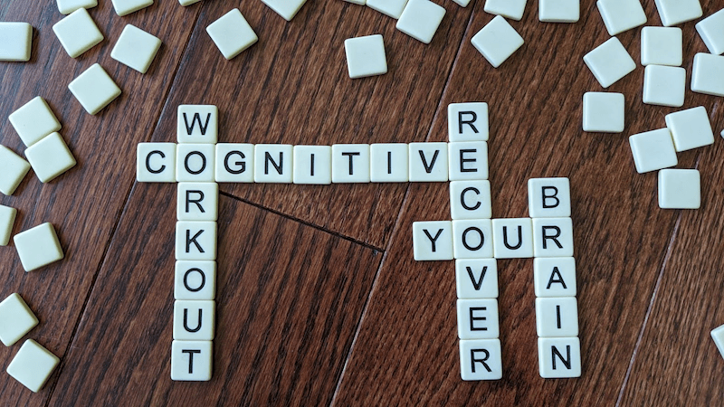 Scrabble letters spelling: Cognitive, Workout, Recover, Your, Brain