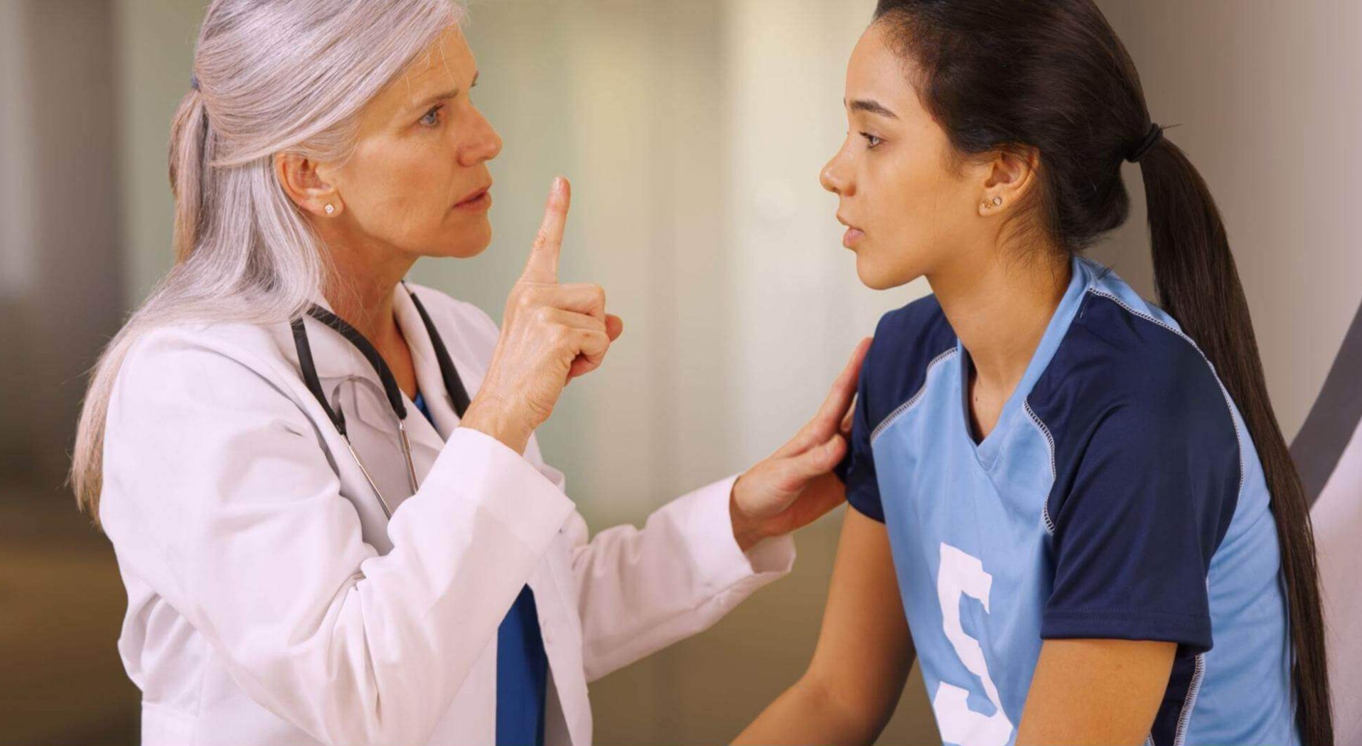doctor evaluating athlete
