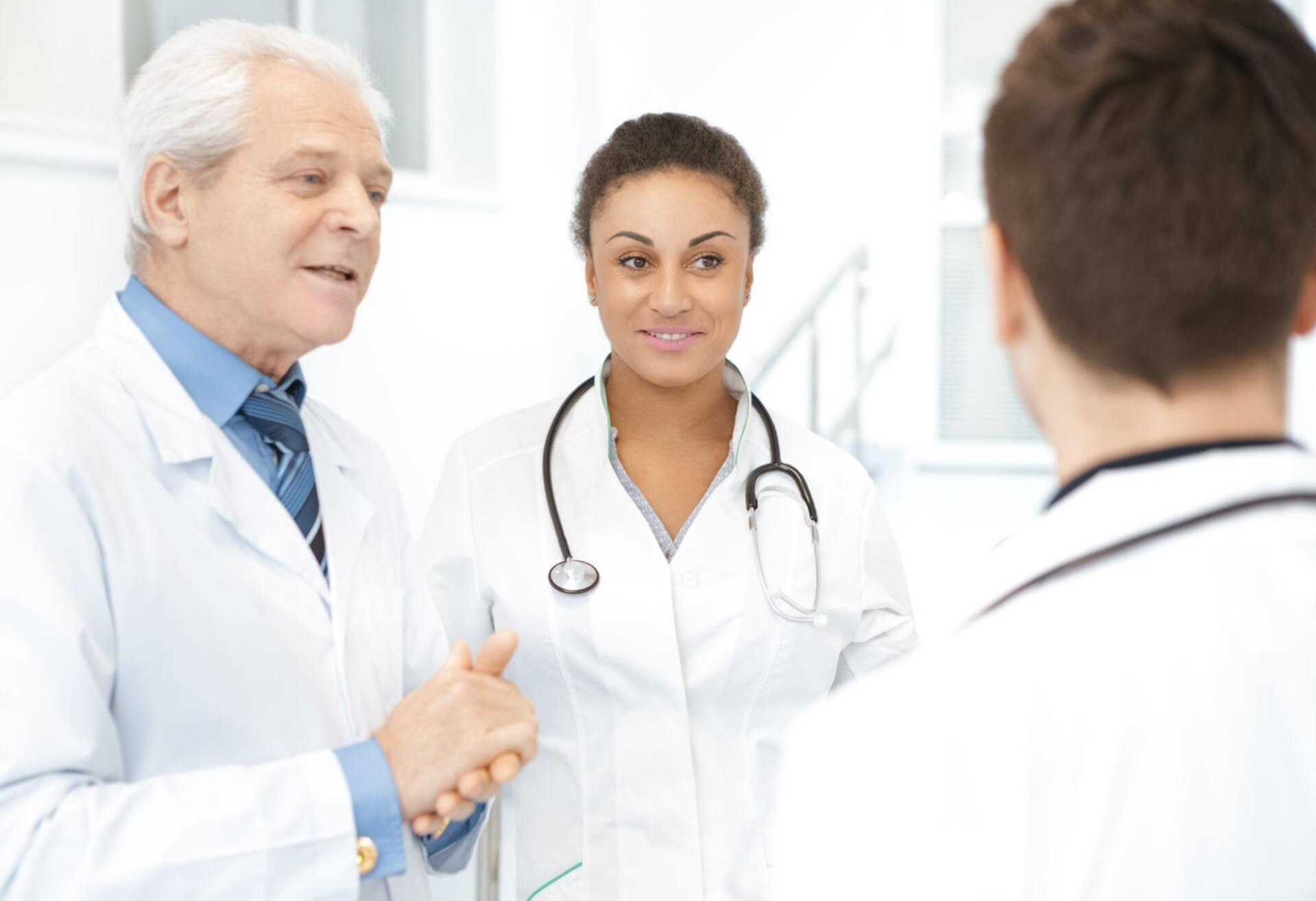 3 MDs are having a conversation about their patients