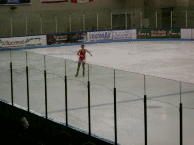 Olivia doing a double lutz, double toe-loop combination during a competition in 2007.