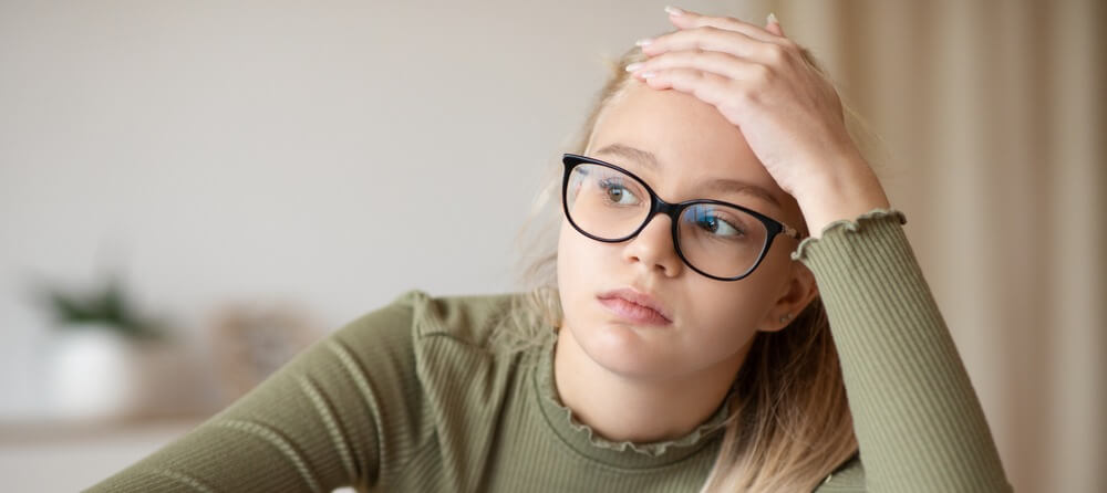 Young girl having trouble focusing. 