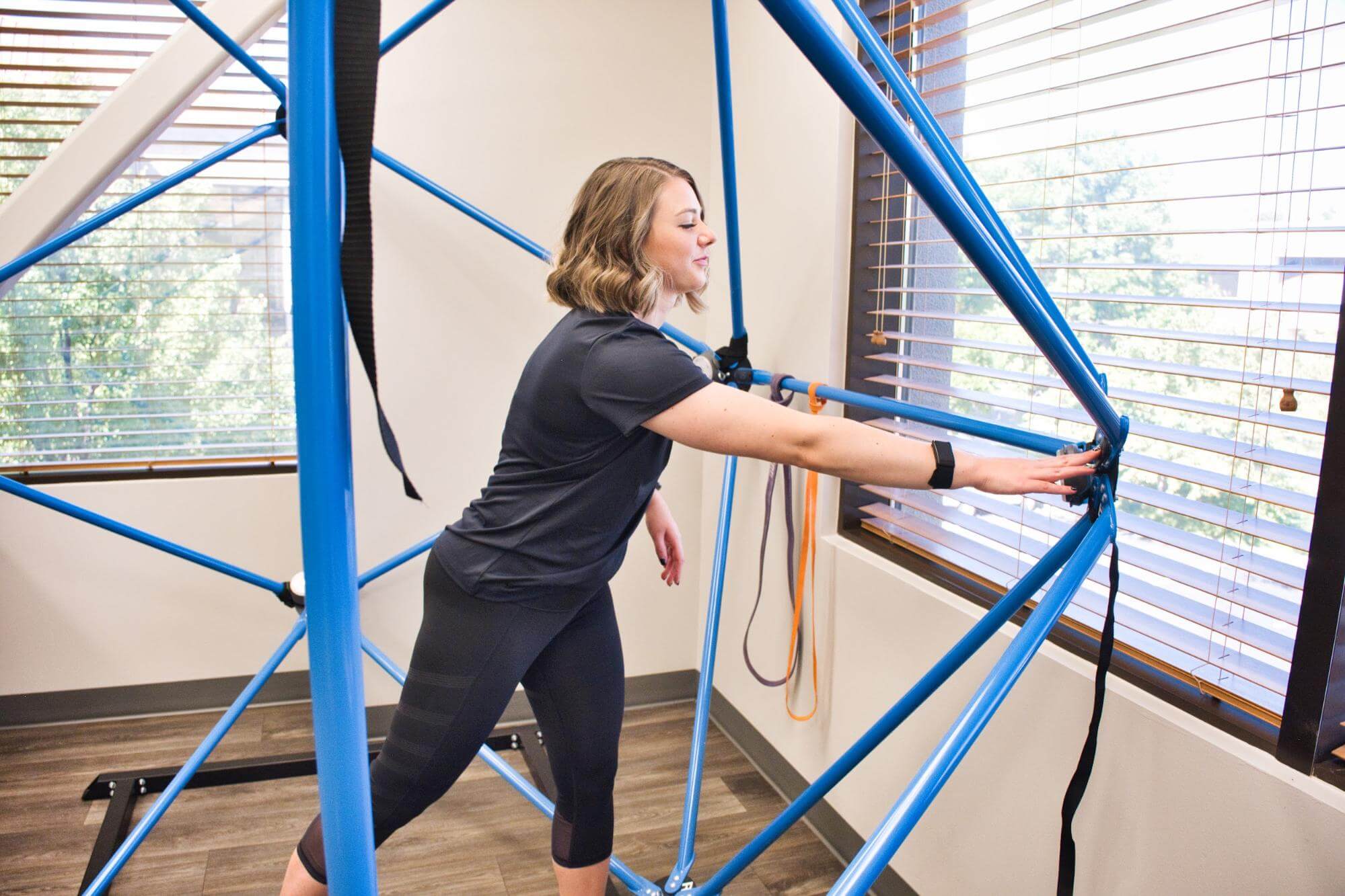 A therapist demonstrates an exercise for sensorimotor therapy at Cognitive FX.