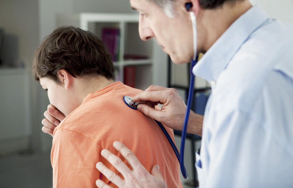 A doctor and a child during a doctor's appointment