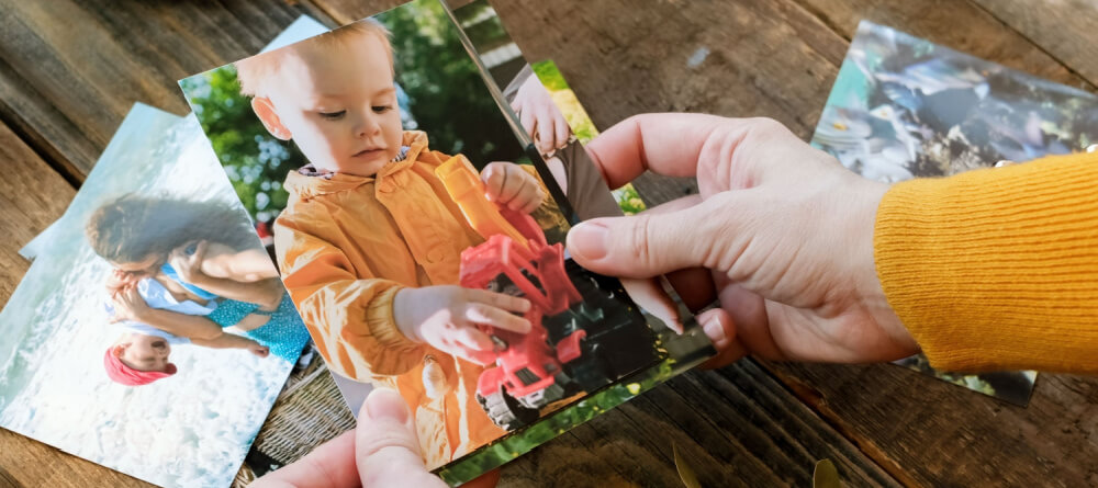A person looking at photos. 