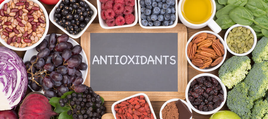 Antioxidants: A photo shows grapes, blueberries, raspberries. nuts and misc veggies.