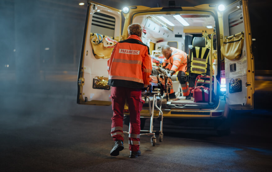 Paramedics providing medical help in their van