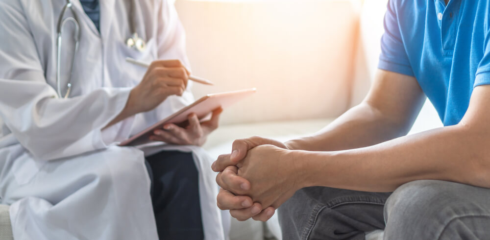A patient and doctor meeting to discuss treatment options