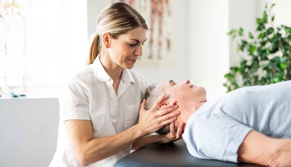 patient being adjusted by chiropractor