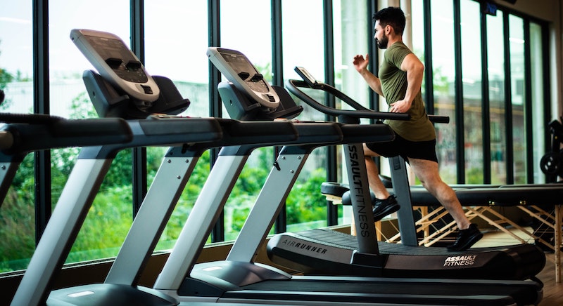 A man is running on a treadmill