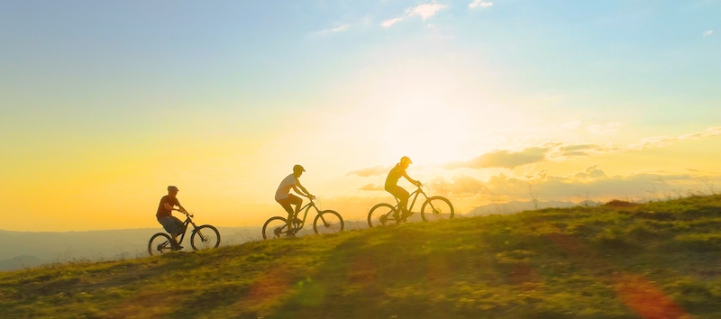 People riding their bikes during Golden Hour