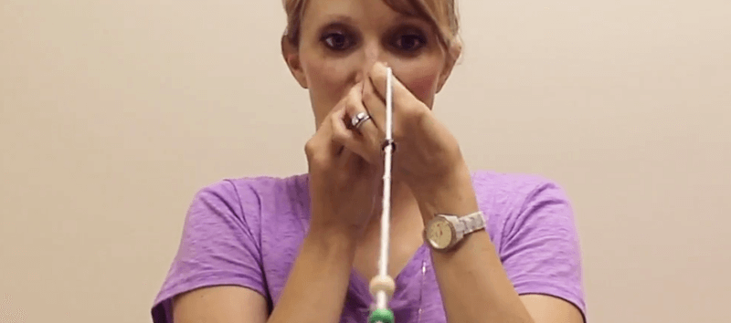 Woman performs a vision test.