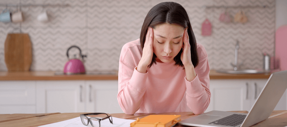 Woman feeling overwhelmed by working on the computer. 