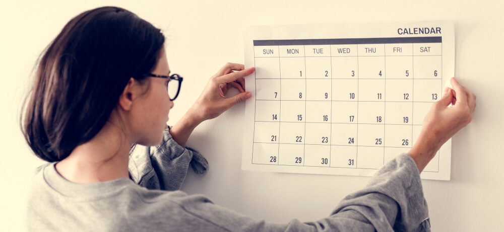 A woman checks her calendar