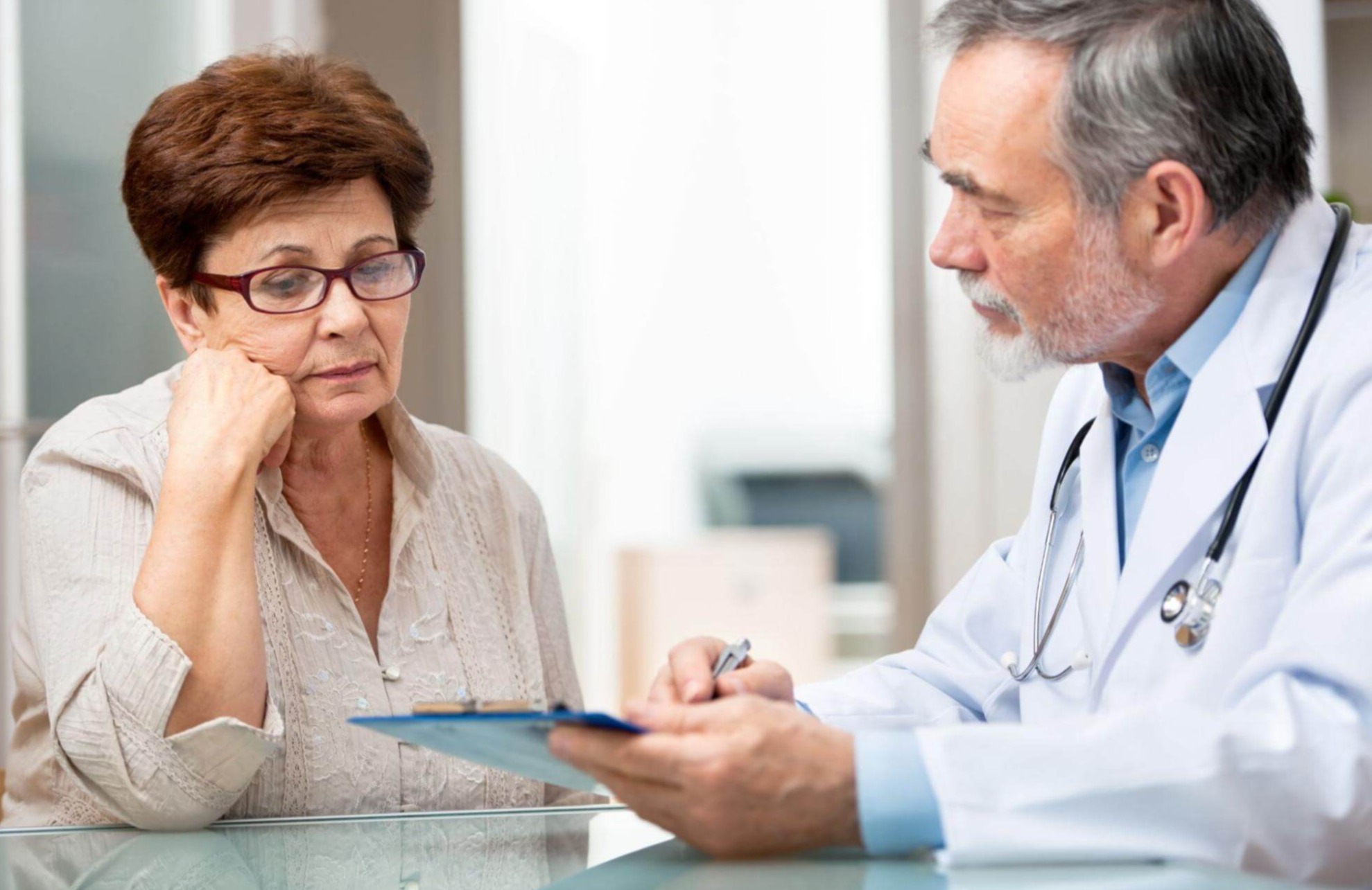 A woman is meeting with her doctor